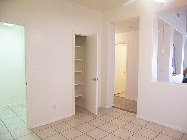 Kitchen pantry and laundry room leading to garage