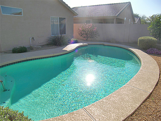 Terraced garden surrounding pool